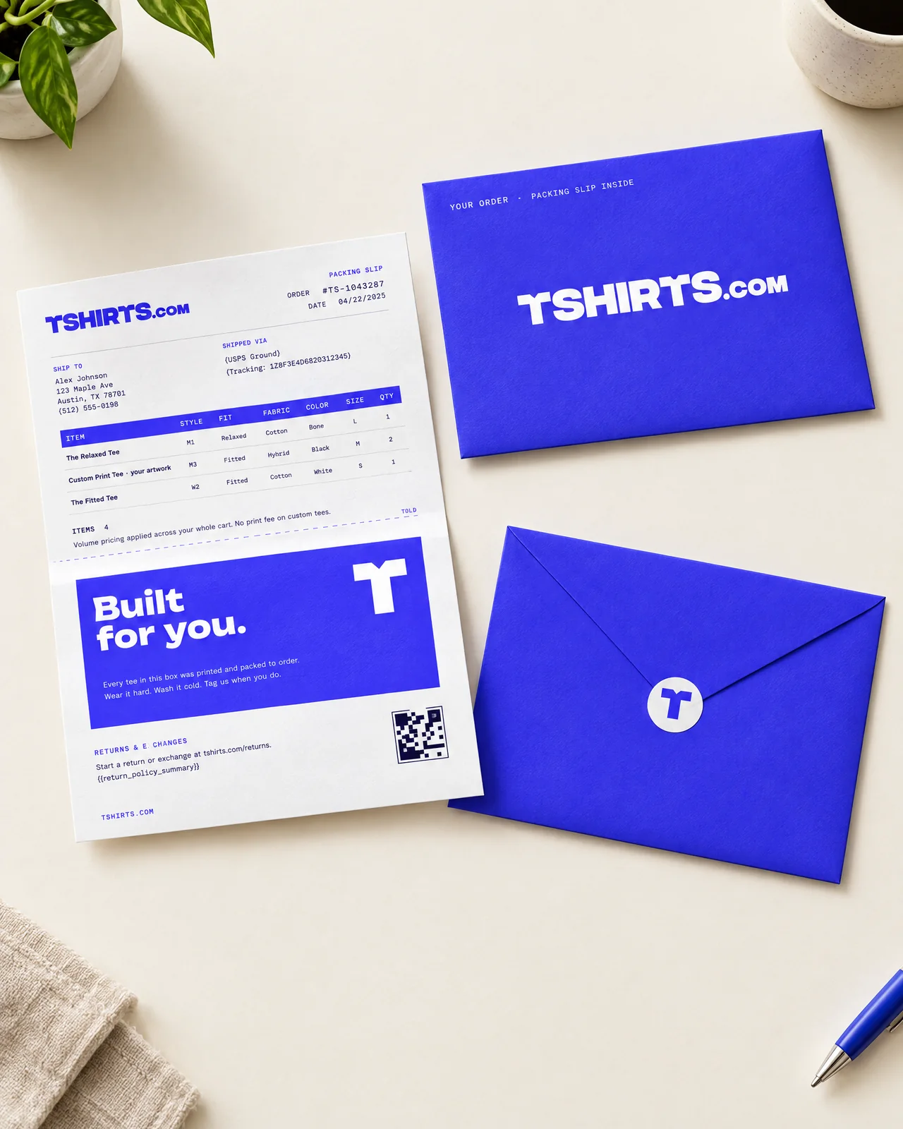 Electric-blue envelope holding a folded TSHIRTS.com packing slip